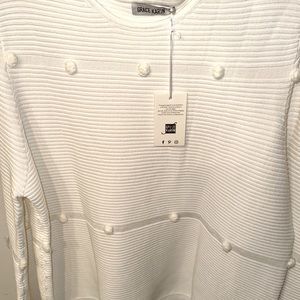 New white sweater, will warm you in cold weather.